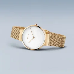 Bering - Klassische Damenuhr in gebürstetem und poliertem Goldduplikat Ø31 mm